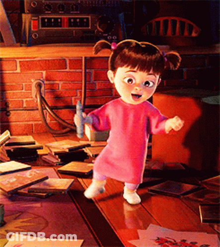 Little Girl Standing On Wooden Table In Pink Sweater GIF