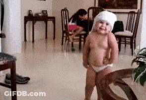 Little Girl Standing With Towel On Head GIF