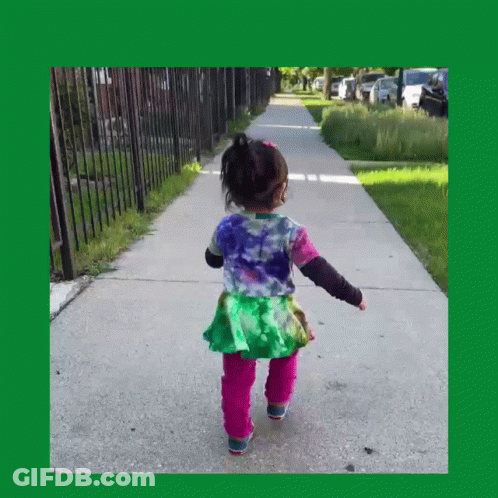 Little Girl Walking In Tie Dye Shirt And Pink Pants GIF