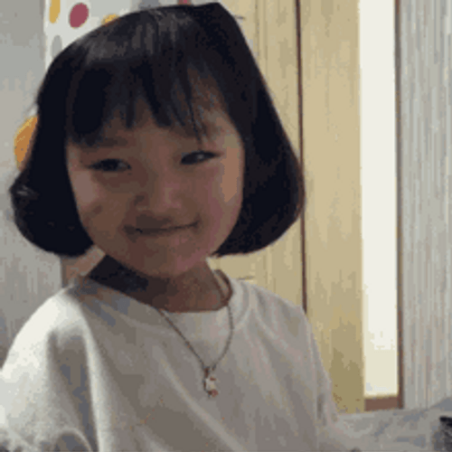 Little Girl Wearing Party Hat Shy GIF