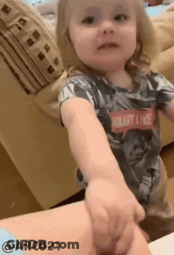 Little Girl Wearing Shirt That Says Baby Like GIF
