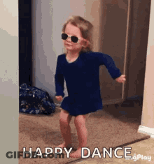 Little Girl Wearing Sunglasses Dancing In Hallway GIF