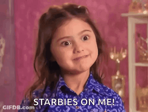 Little Girl With Curly Hair In Crib Looking At Camera GIF