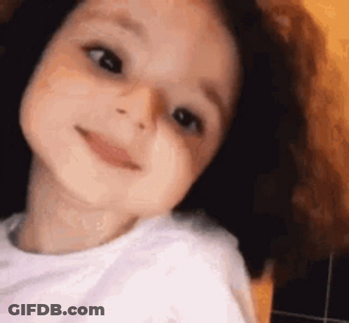 Little Girl With Long Hair Smiling GIF