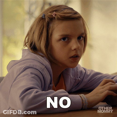 Little Girl With No On Shirt Sitting At Table GIF