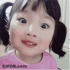 Little Girl With Pigtails Making Funny Face GIF
