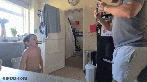 Little Girl With Purple Eyes Standing With Characters GIF