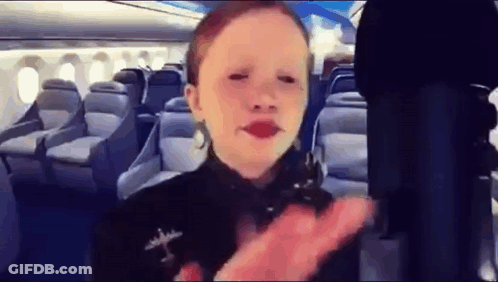 Little Girl With Red Lipstick On Airplane GIF