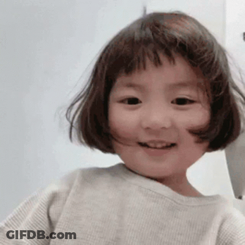 Little Girl With Short Brown Hair Smiling GIF