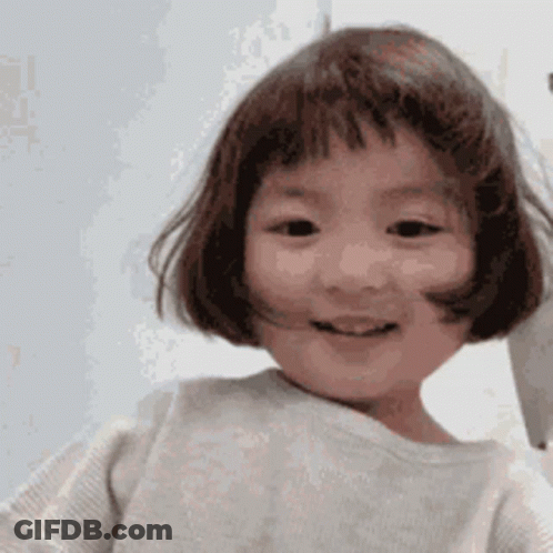 Little Girl With Short Hair And Bangs Smiling GIF