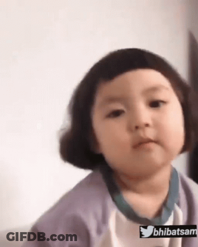 Little Girl With Short Hair Making Funny Face On Couch GIF