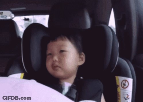 Little Girl With Yellow J In Car Seat GIF