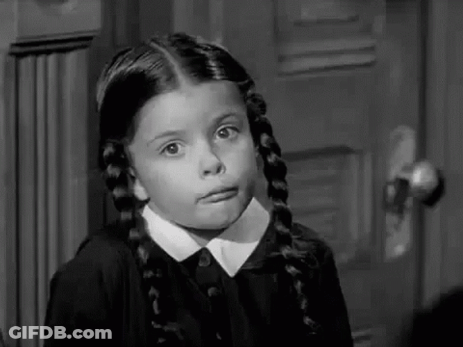 Little Wednesday Addams Shrugging Shoulder GIF