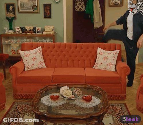 Living Room With Red Couch And Glass Coffee Table GIF