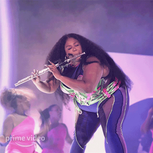 Lizzo Pink Flute Spotlight GIF