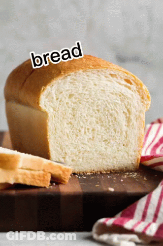 Loaf Of Bread On Wooden Cutting Board Saying Bread GIF