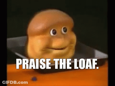 Loaf Of Bread With Face And Words Praise The Loaf GIF
