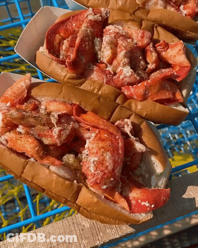 Lobster Rolls On Wooden Table GIF