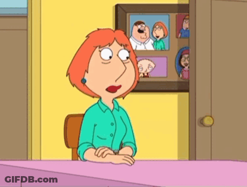 Lois Griffin From Family Guy Is Sitting At A Desk GIF