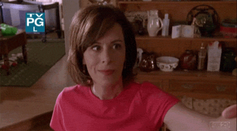 Lois Wilkerson Taking Polaroid Selfie GIF