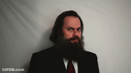 Long Bearded Man In Black Suit Red Tie GIF