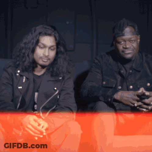 Long Hair Man Sitting Next To Short Hair Man GIF