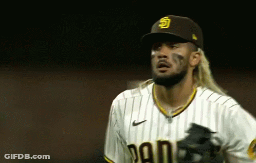 Long-Haired Baseball Player In Hat And Striped Shirt GIF