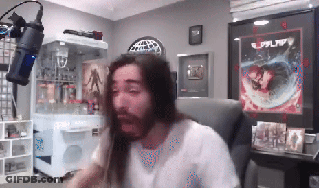 Long-Haired Bearded Man At Microphone GIF
