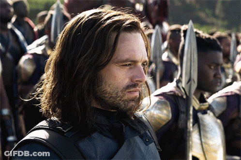 Long Haired Bearded Man Holding Spear Before Crowd GIF