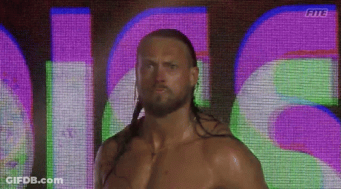 Long Haired Bearded Man In Front Of Fits Screen GIF