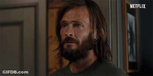 Long Haired Bearded Man In Front Of Netflix Logo GIF