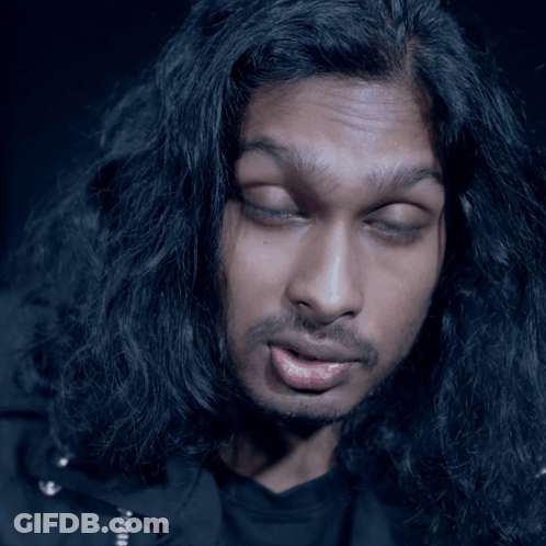 Long Haired Bearded Man Making Funny Face GIF