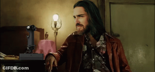 Long Haired Bearded Man With Remote Saying X GIF