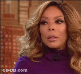 Long-Haired Blonde Woman Purple Sweater Funny Face GIF