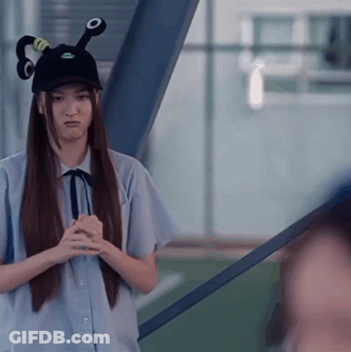 Long-Haired Girl In Black Hat With Green O GIF