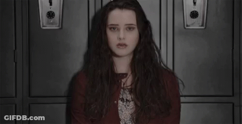 Long-Haired Girl Sitting In Front Of Lockers GIF