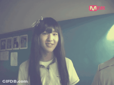 Long-Haired Girl Smiling At Mnet Sign GIF