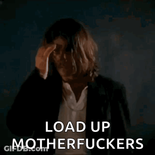Long-Haired Man Holding Gun Says Load Up Motherfuckers GIF