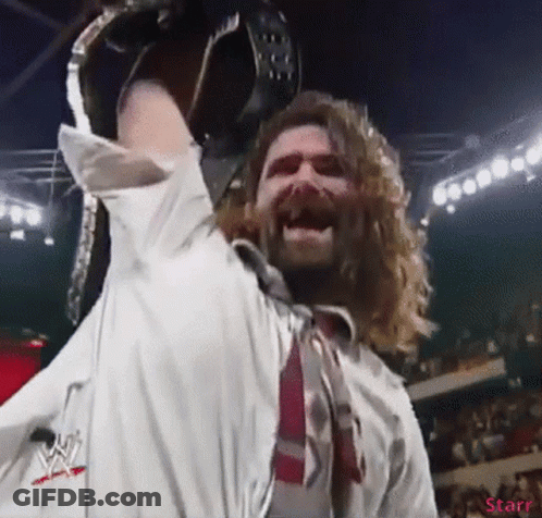 Long-Haired Man Holding Wrestling Belt GIF