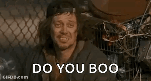 Long Haired Man In Hat In Trash Can Asks Do You Boo GIF