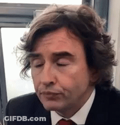 Long-Haired Man In Suit And Tie Funny Face GIF