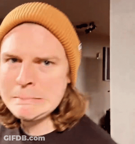 Long Haired Man In Yellow Beanie Funny Face GIF