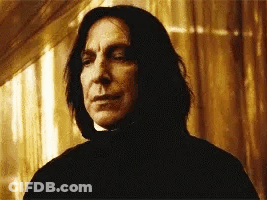Long-Haired Man Looking At Camera Through Window GIF