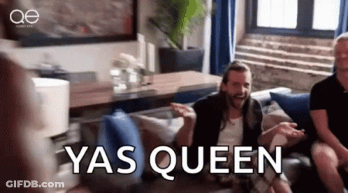 Long Haired Man Saying Yas Queen On Couch GIF