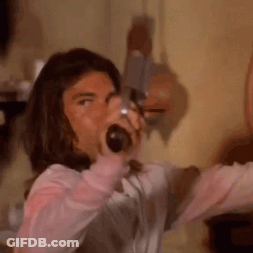 Long-Haired Man Screaming With Bottle In Mouth GIF
