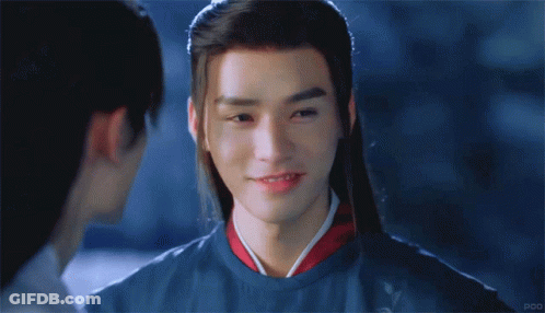 Long-Haired Man Smiling At Another Man GIF