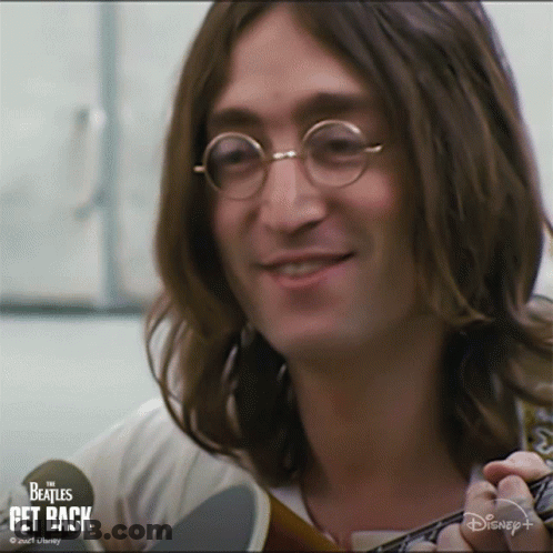 Long Haired Man Smiling Holding Guitar Disney+ Logo GIF