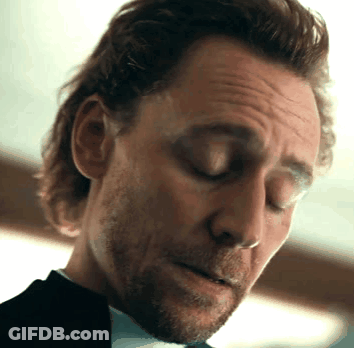 Long Haired Man With Beard Eyes Closed Looking Down GIF