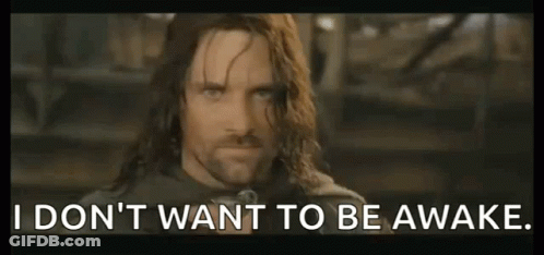 Long-Haired Man With Sign I Don't Want To Be Awake GIF