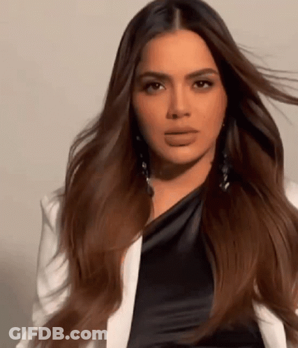 Long-Haired Woman In White Jacket And Black Dress GIF